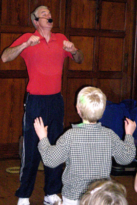 John getting the children nvolved in a party game